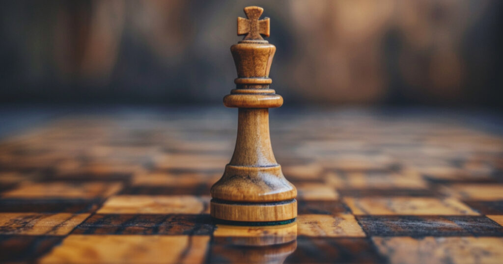 A chessboard with a single chess piece standing tall and confident, representing the idea of playing the hand you're dealt and making the most of your circumstances to achieve success.